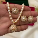 Pink freshwater pearl necklace set with floral pendant, matching floral earrings and adjustable ring by Glamify