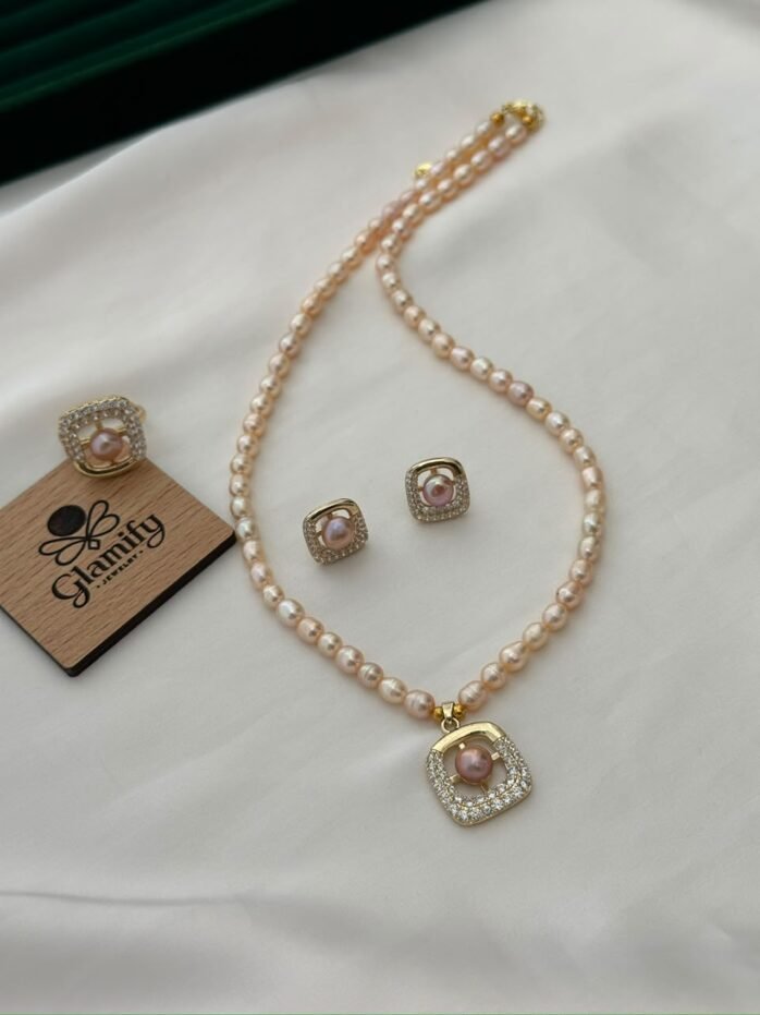 Pink freshwater pearl necklace set with square stone-detailed pendant, matching earrings and adjustable ring by Glamify