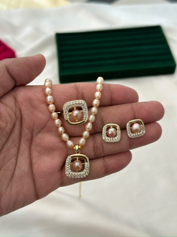 Pink freshwater pearl necklace set with square stone-detailed pendant, matching earrings and adjustable ring by Glamify