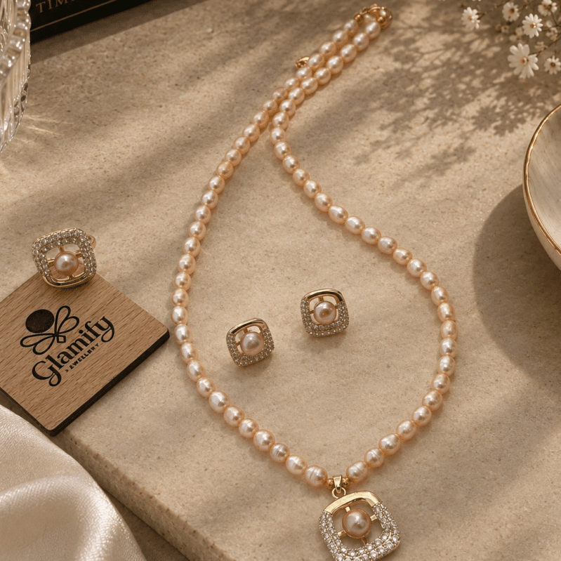 Pink freshwater pearl necklace set with square stone-detailed pendant, matching earrings and adjustable ring by Glamify